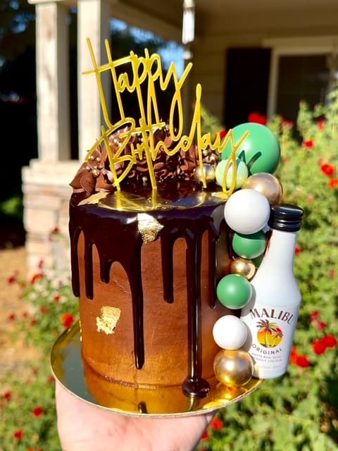Chocolate rum birthday cake with decorative piping