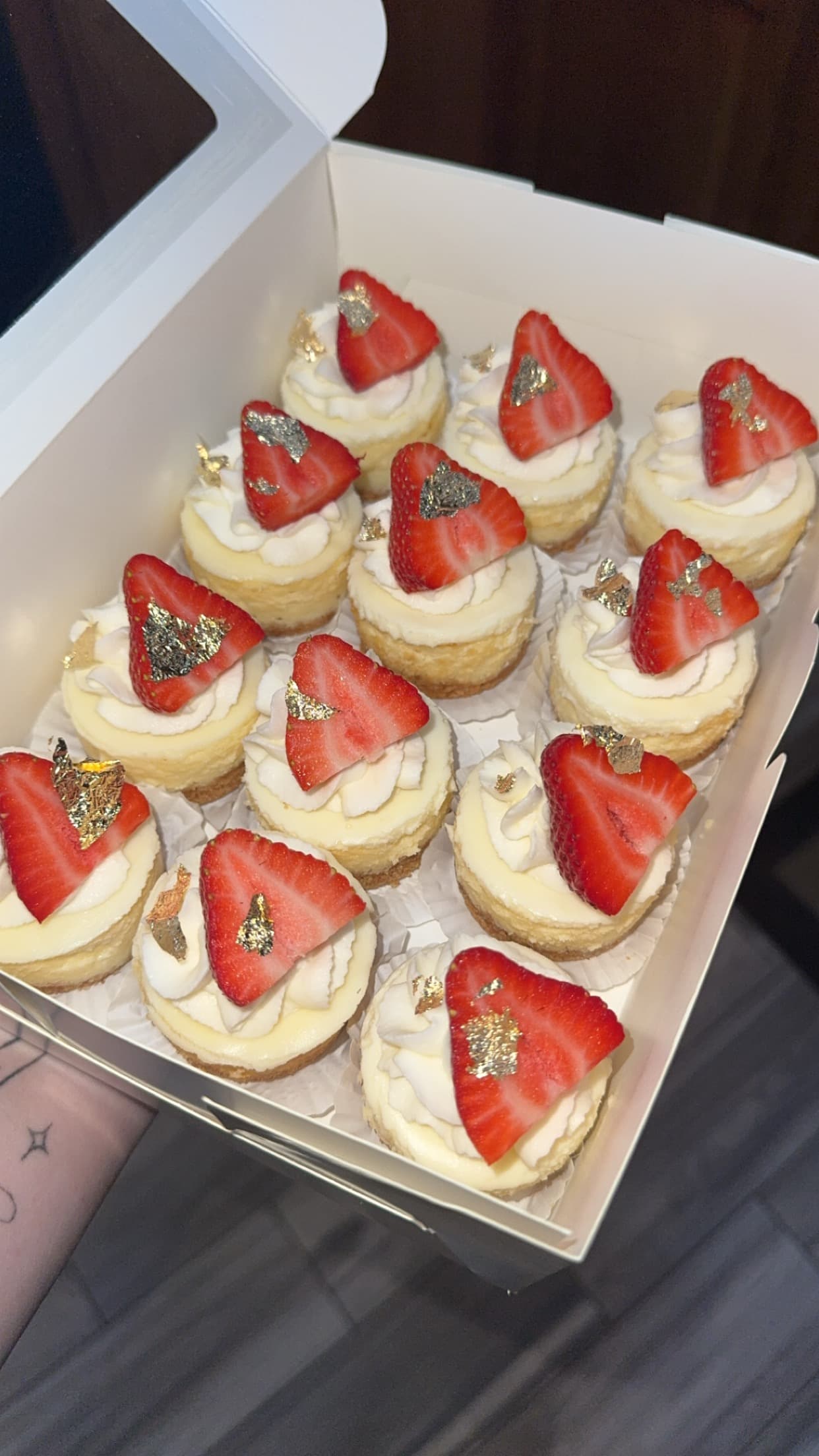 Strawberry mini cheesecakes arranged on a serving tray